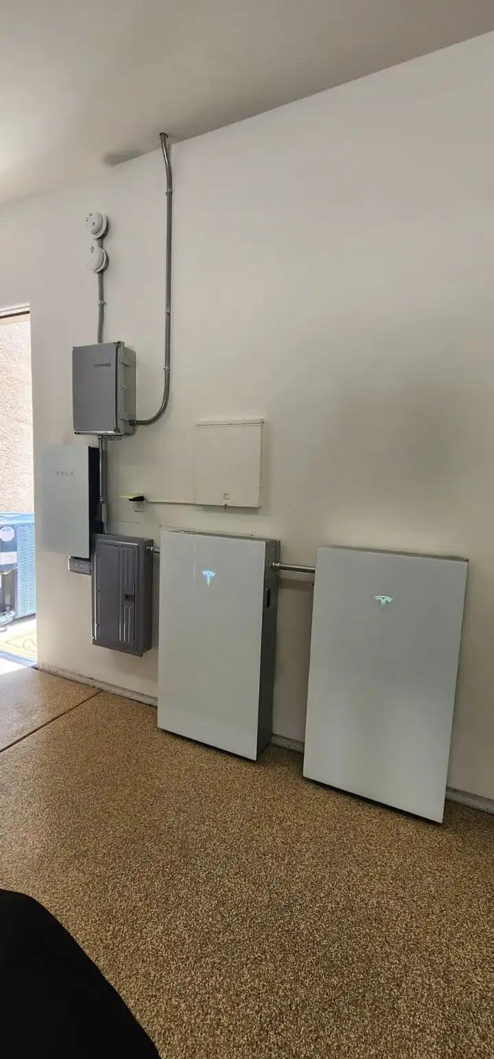 Home energy equipment installed on a garage wall